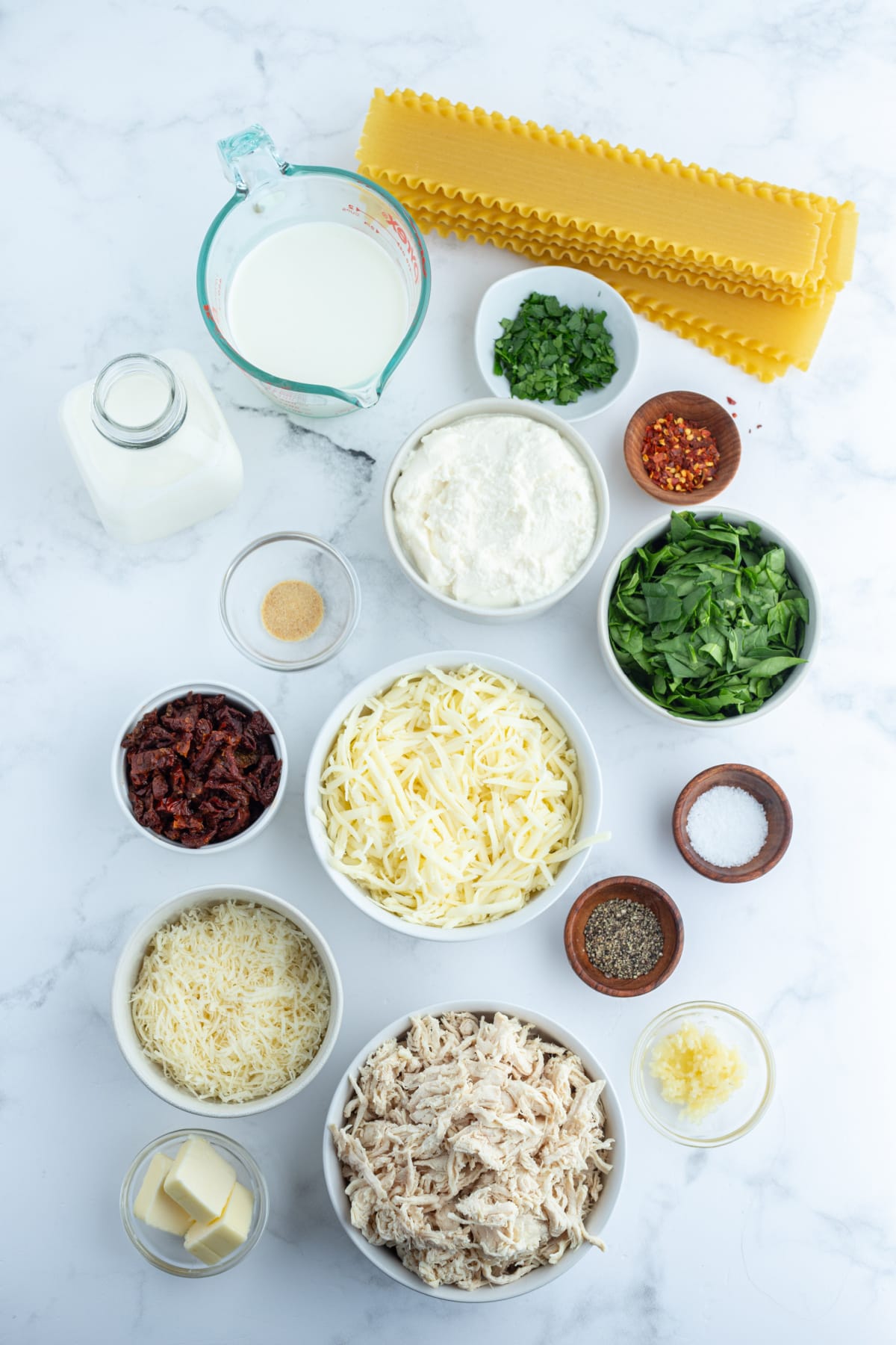 ingredients displayed for making marry me chicken lasagna