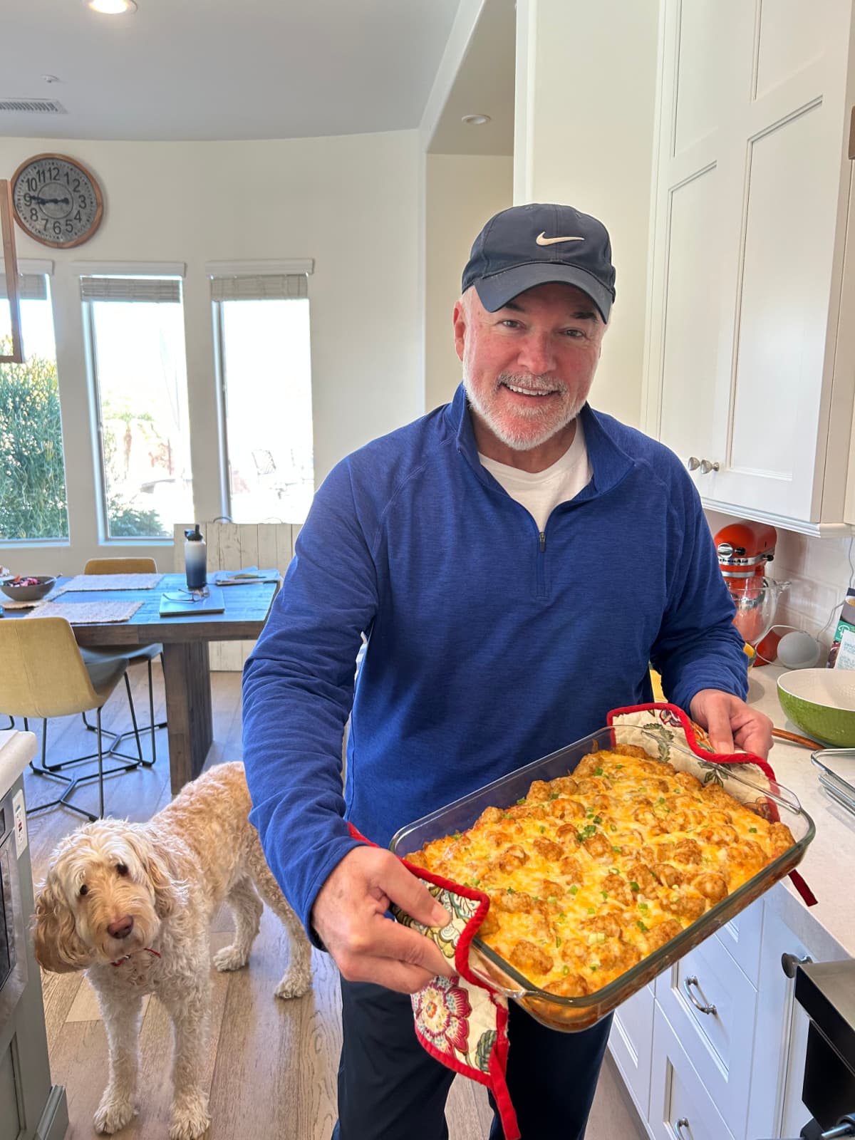 RecipeGirl husband holding tater tot breakfast casserole