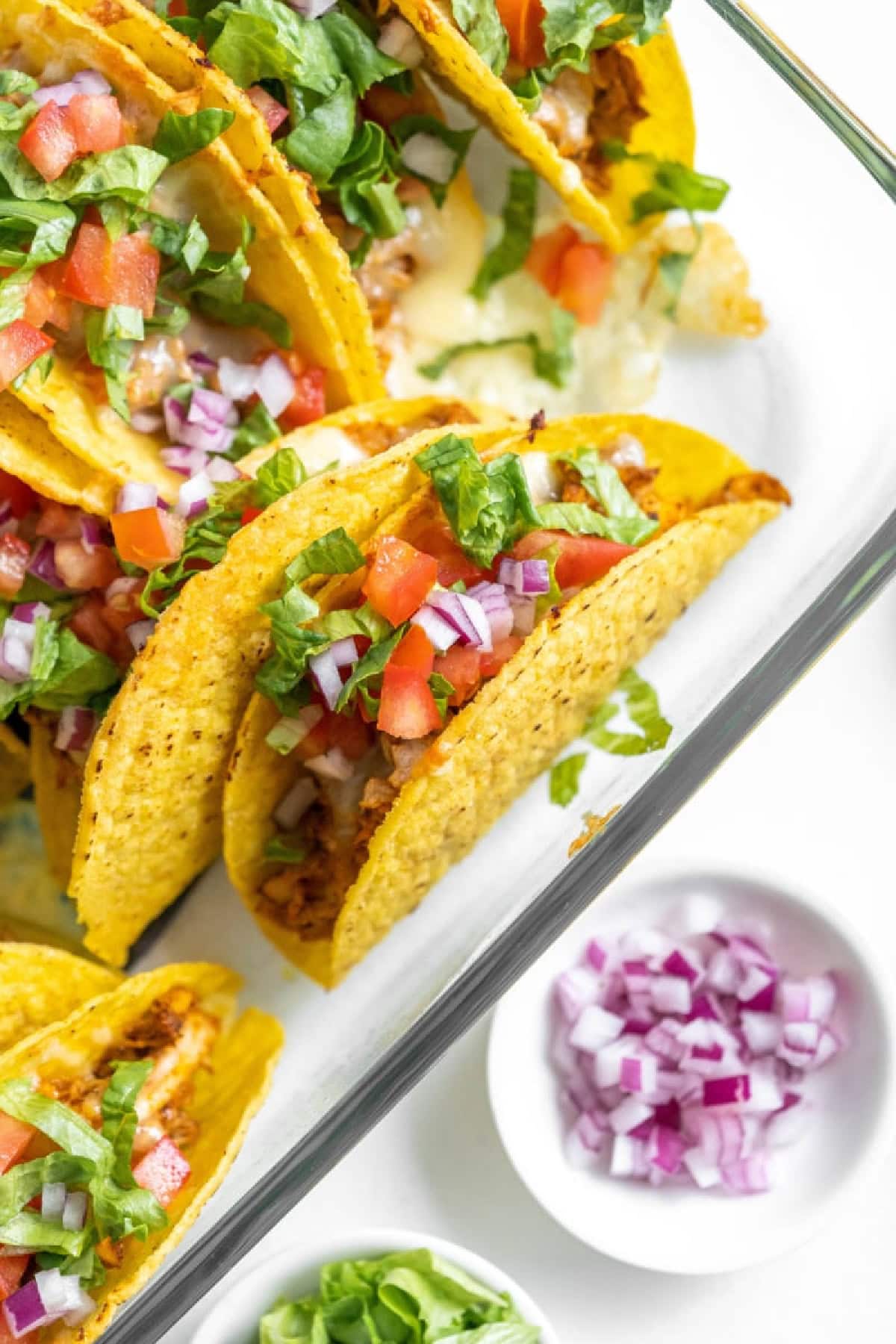 baked chicken tacos in a glass pan