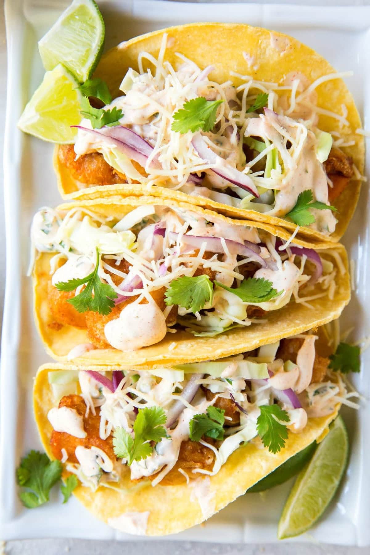 three beer battered fish tacos