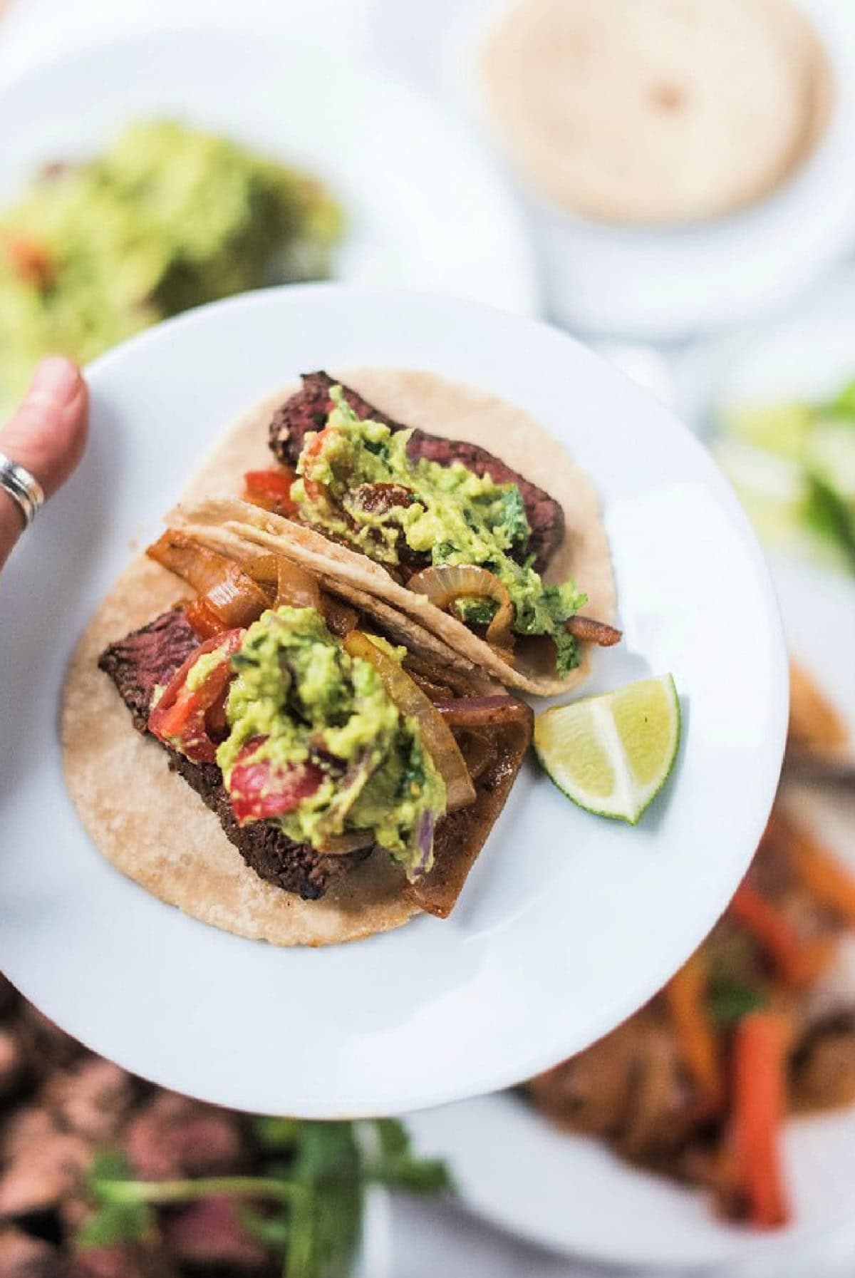 two chili lime steak fajita tacos on plate