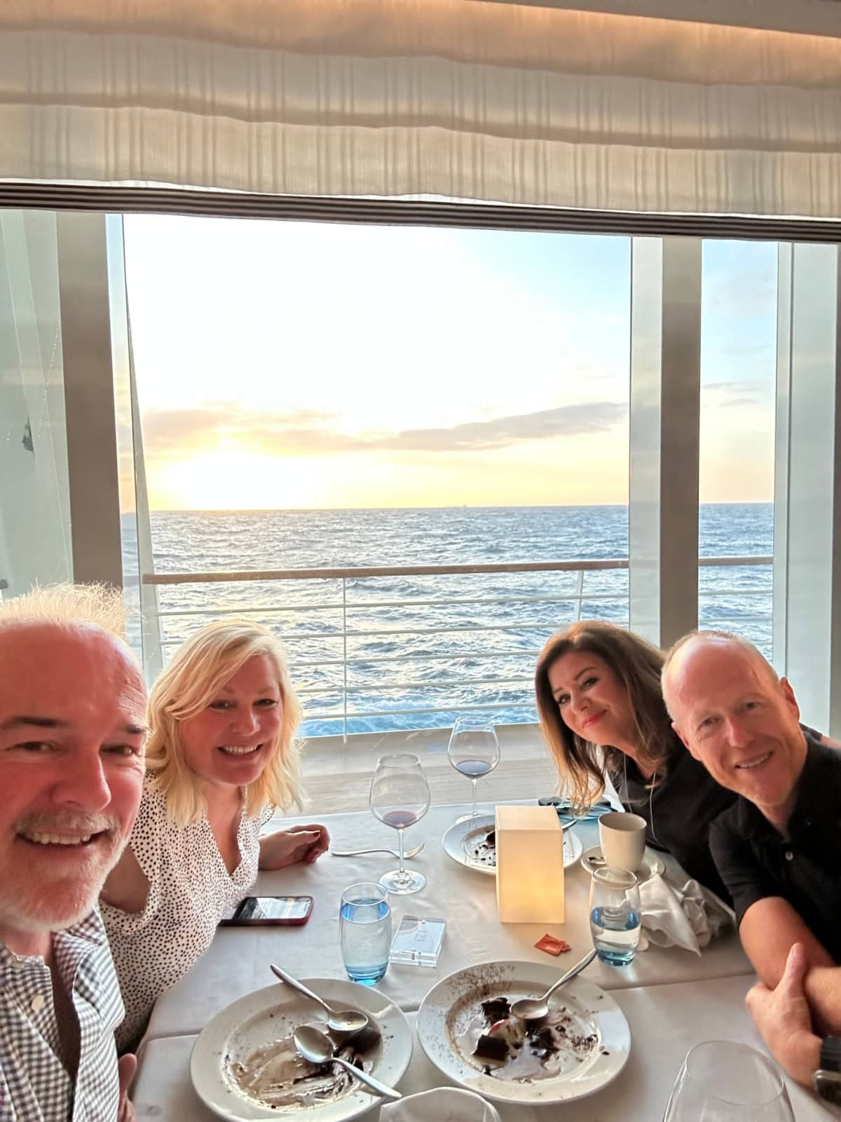 Viking Cruise: Barcelona to Bergen- the Trade Routes of the Middle Ages - a review with lots of photographs on RecipeGirl.com two couples eating at table viking cruises