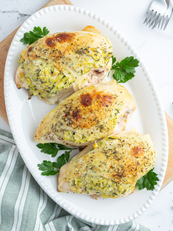 three stuffed chicken breast on a plate