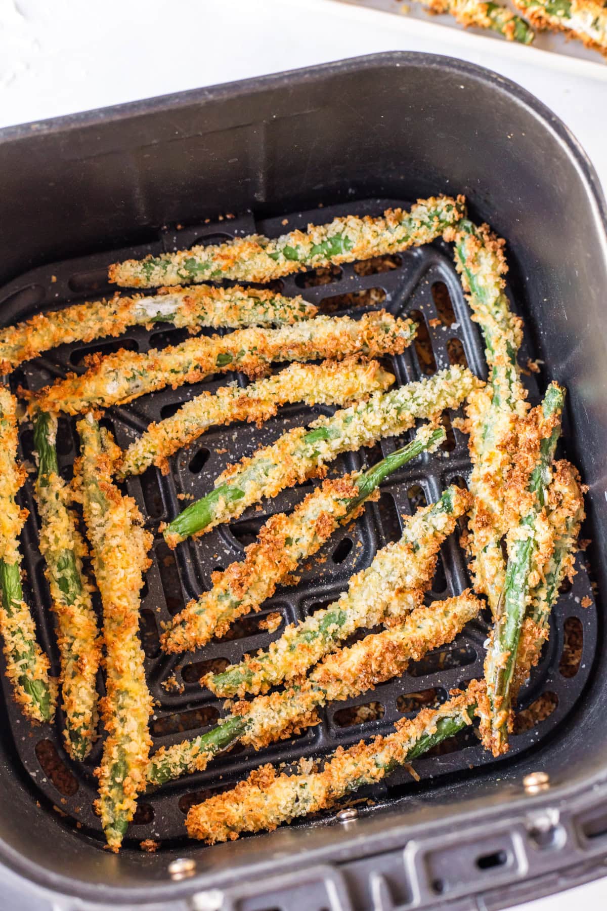 air fryer fried green beans in air fryer basket