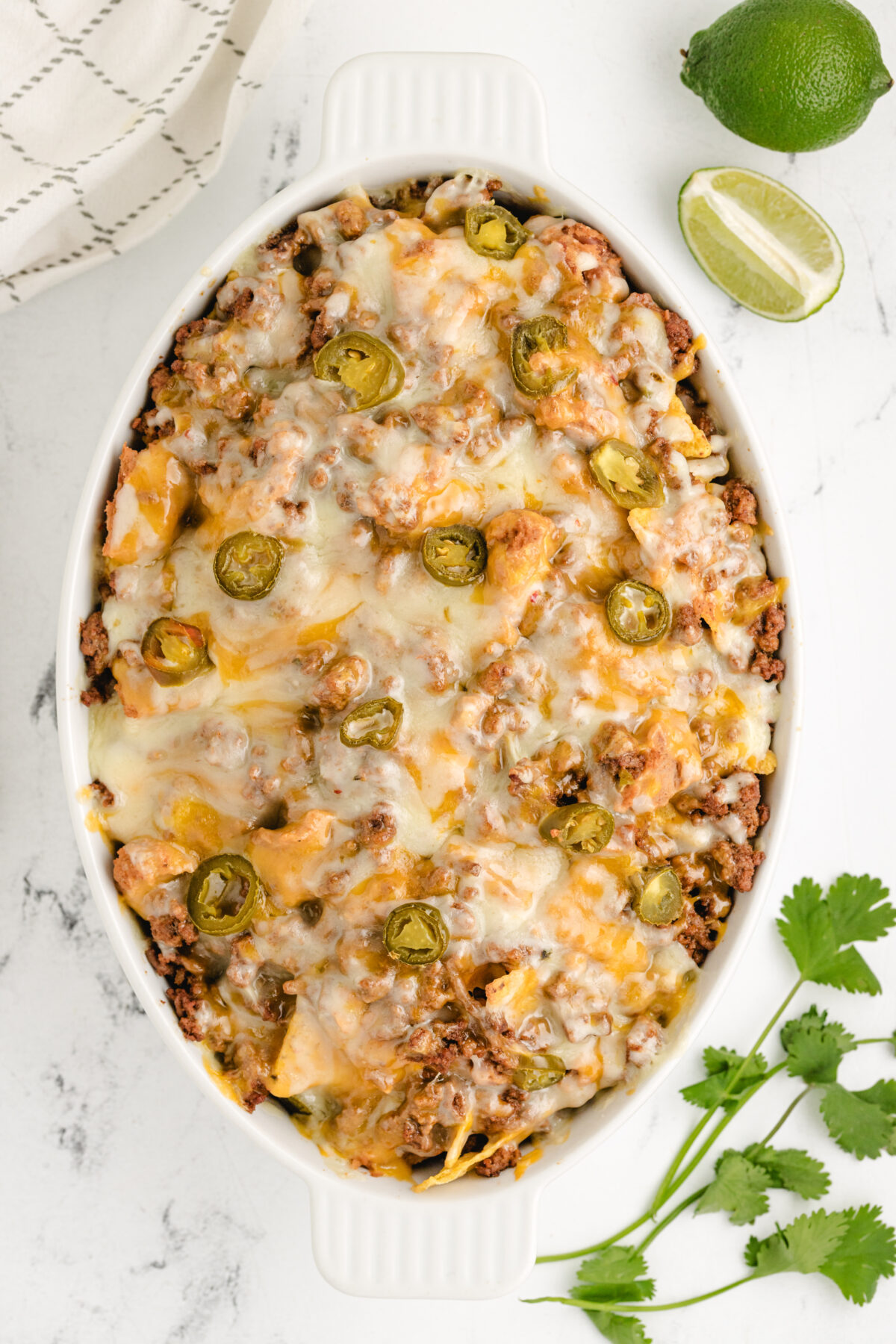 Ground Beef Nachos recipe from RecipeGirl.com dish of melted ground beef nachos