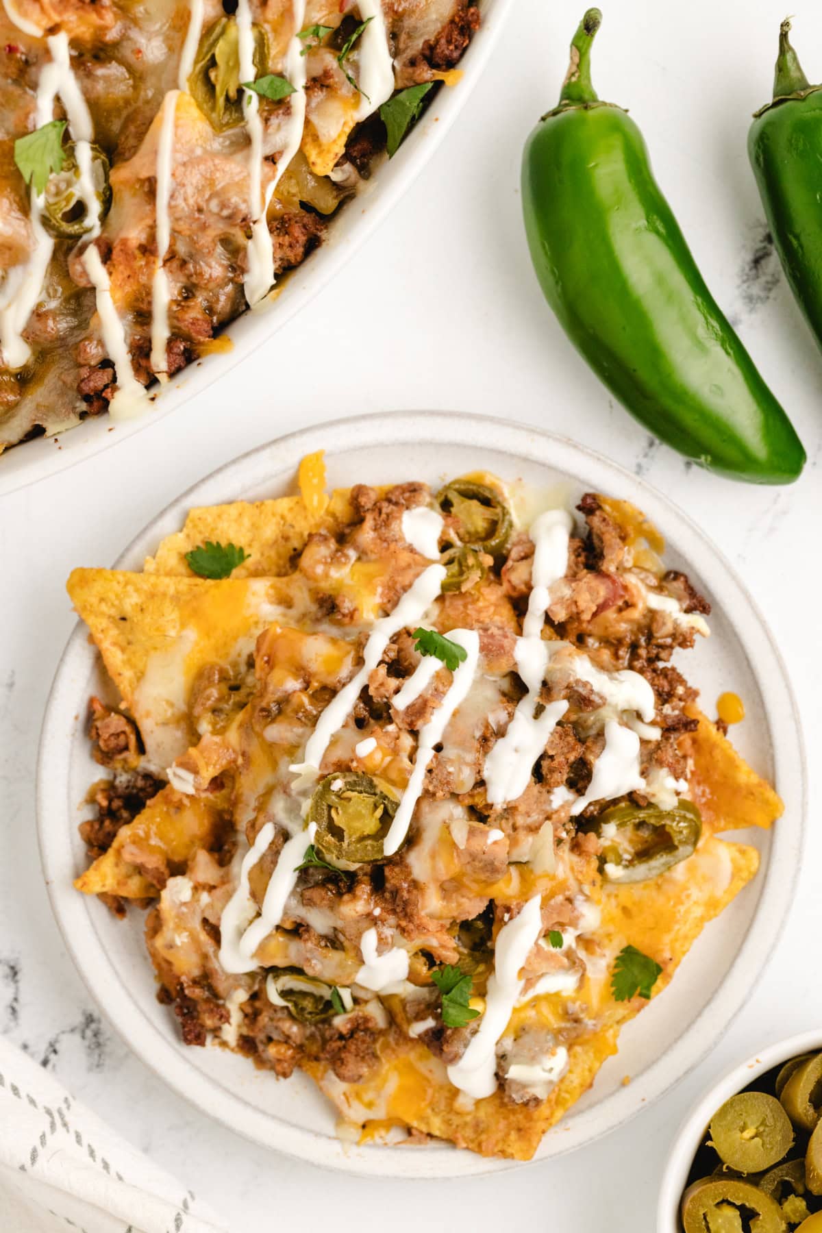 Ground Beef Nachos recipe from RecipeGirl.com ground beef nachos on a plate