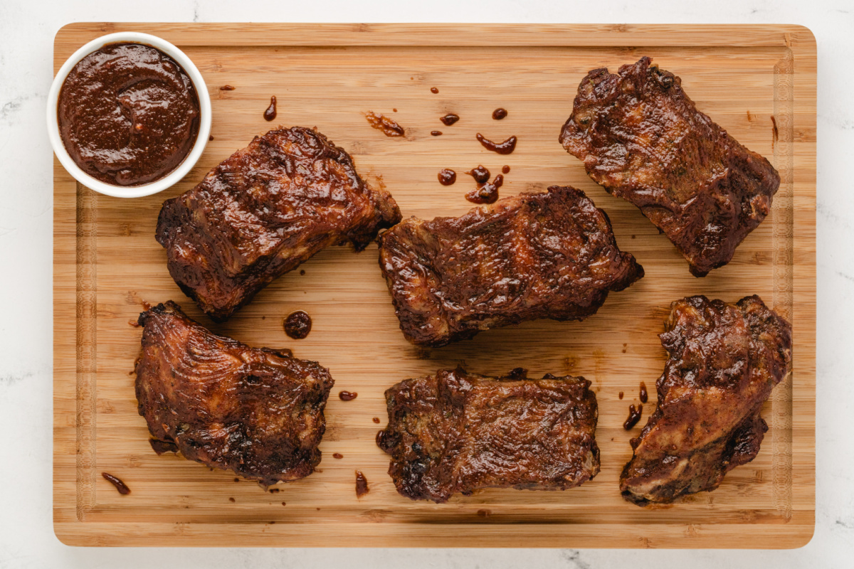 Slow Cooker Baby Back Ribs recipe from RecipeGirl.com : crockpot ribs : crock pot ribs : slow cooked pork ribs baby back ribs on a board with a bowl of sauce