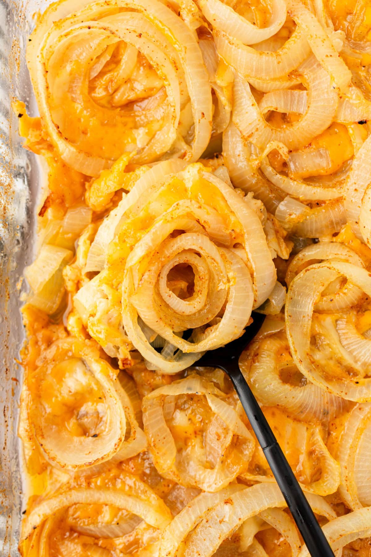 Tennessee Onions recipe from RecipeGirl.com spoon in pan of tennessee onions