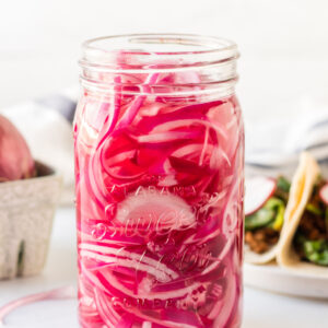 side shot of jar of quick pickled red onions