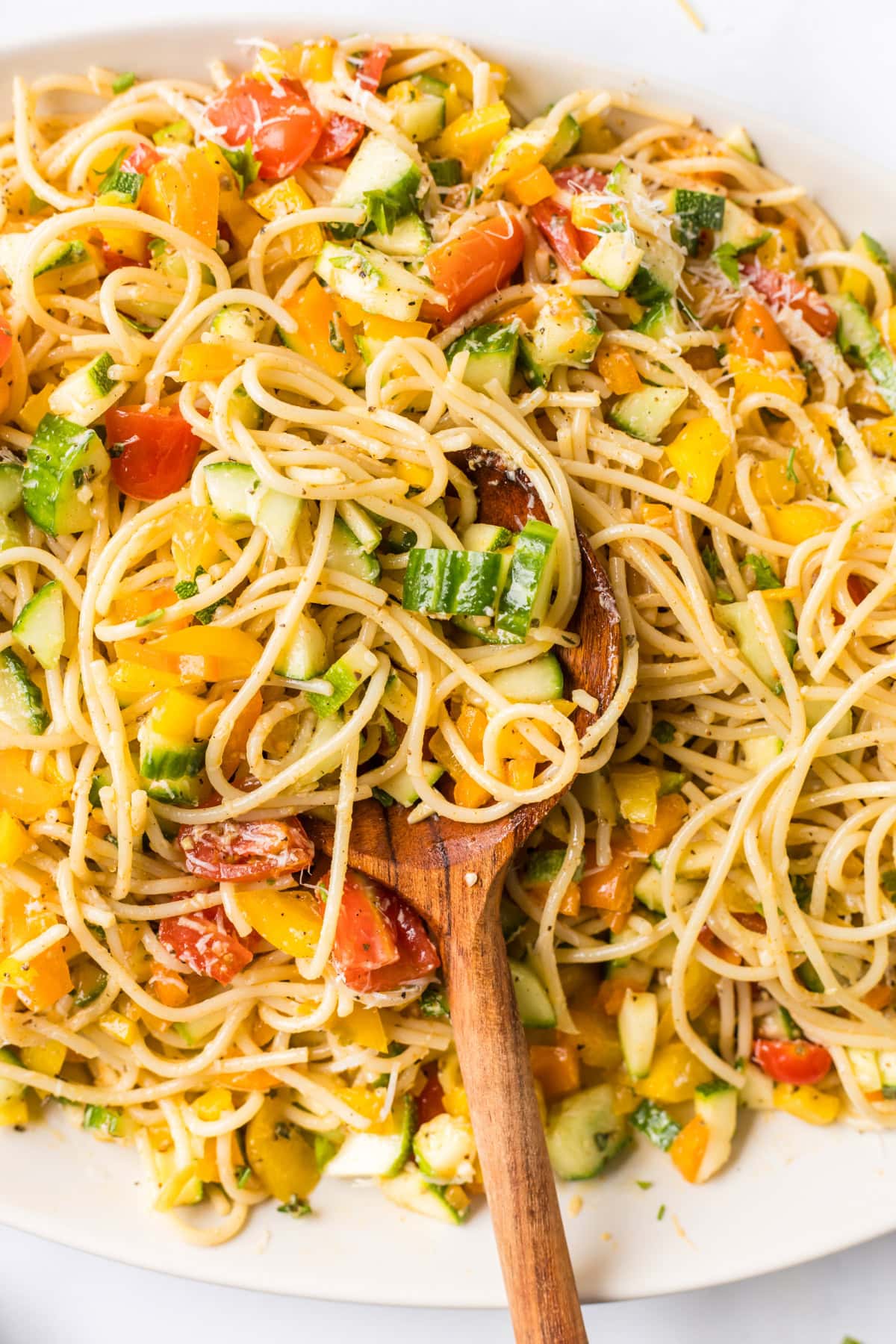 Cold Spaghetti Salad recipe from RecipeGirl.com : easy Italian pasta salad serving spoon in dish of cold spaghetti salad