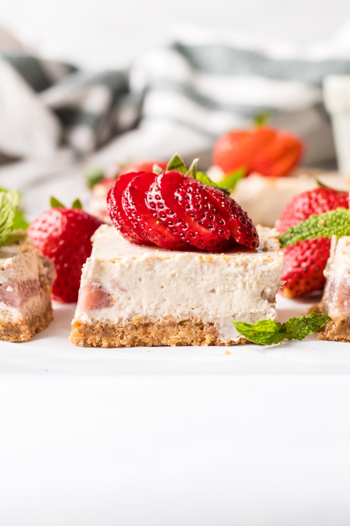 Strawberry Cheesecake Bars recipe from RecipeGirl.com strawberry cheesecake bar