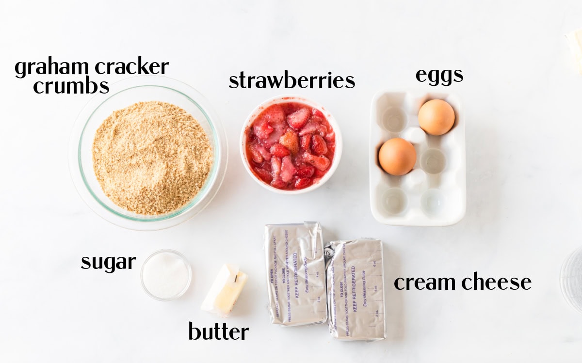 Strawberry Cheesecake Bars recipe from RecipeGirl.com ingredients displayed for making strawberry cheesecake bars