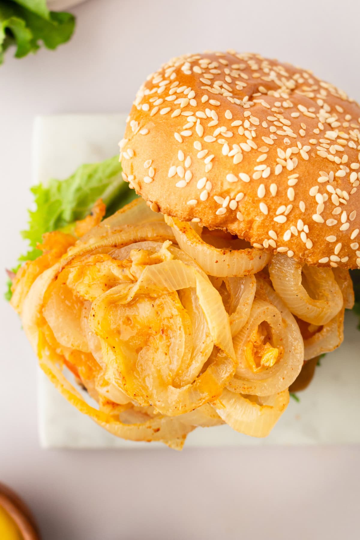 burger piled with onions