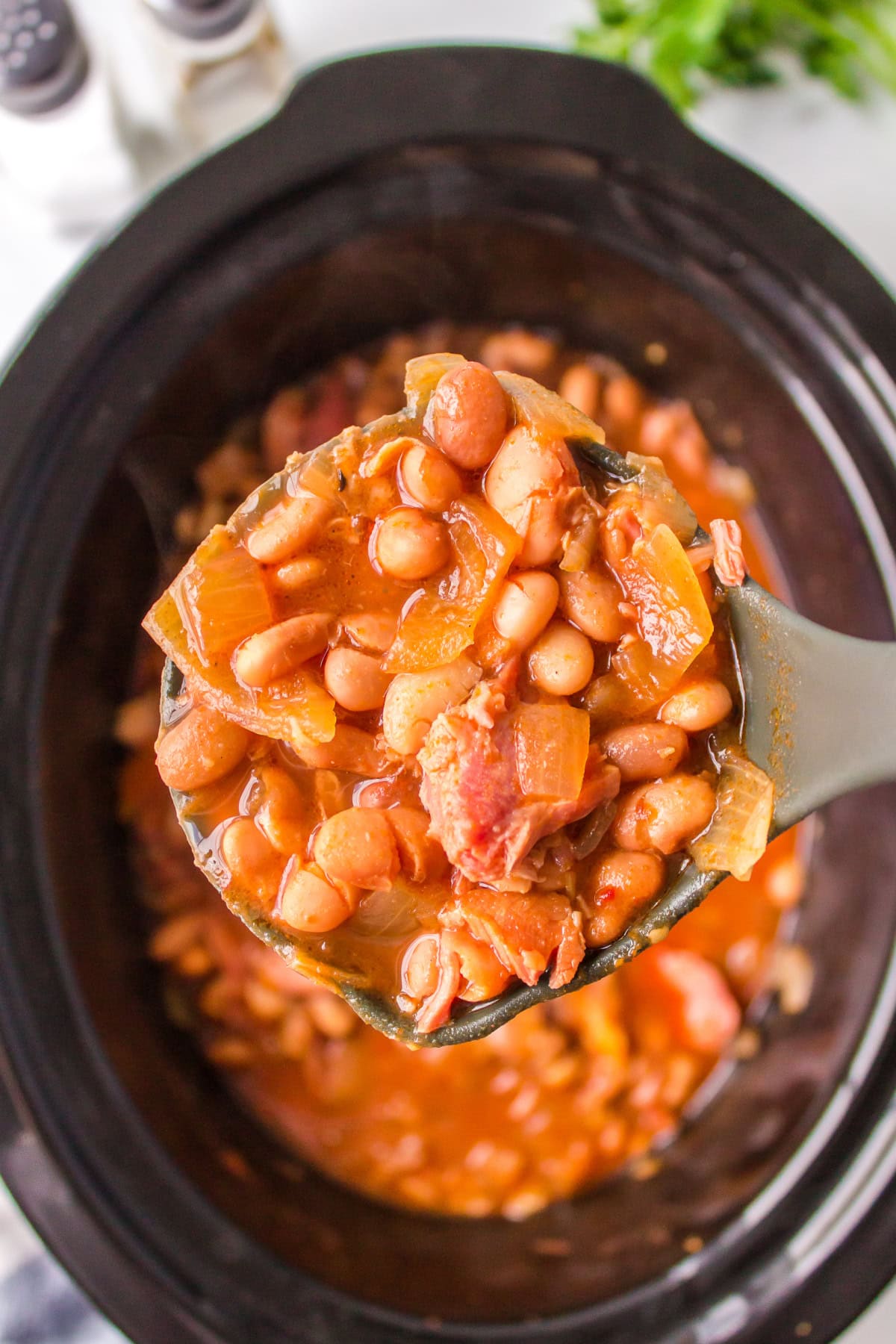 Ranch Style Beans recipe : Dude Ranch Beans from RecipeGirl.com Ranch Style Beans in a Slow Cooker with a ladle of beans