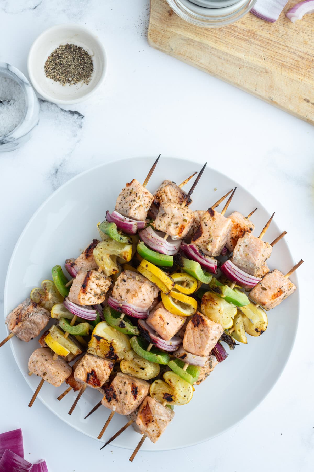 Grilled Salmon and Veggie Kabobs recipe from RecipeGirl.com overhead shot of grilled salmon and veggie kabobs on plate