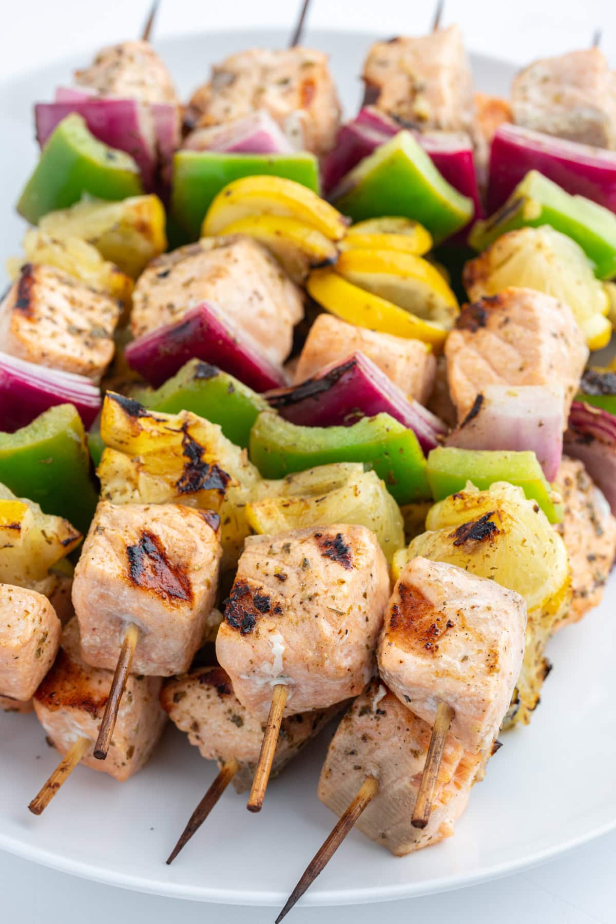 Grilled Salmon and Veggie Kabobs recipe from RecipeGirl.com several grilled salmon and veggie kabobs