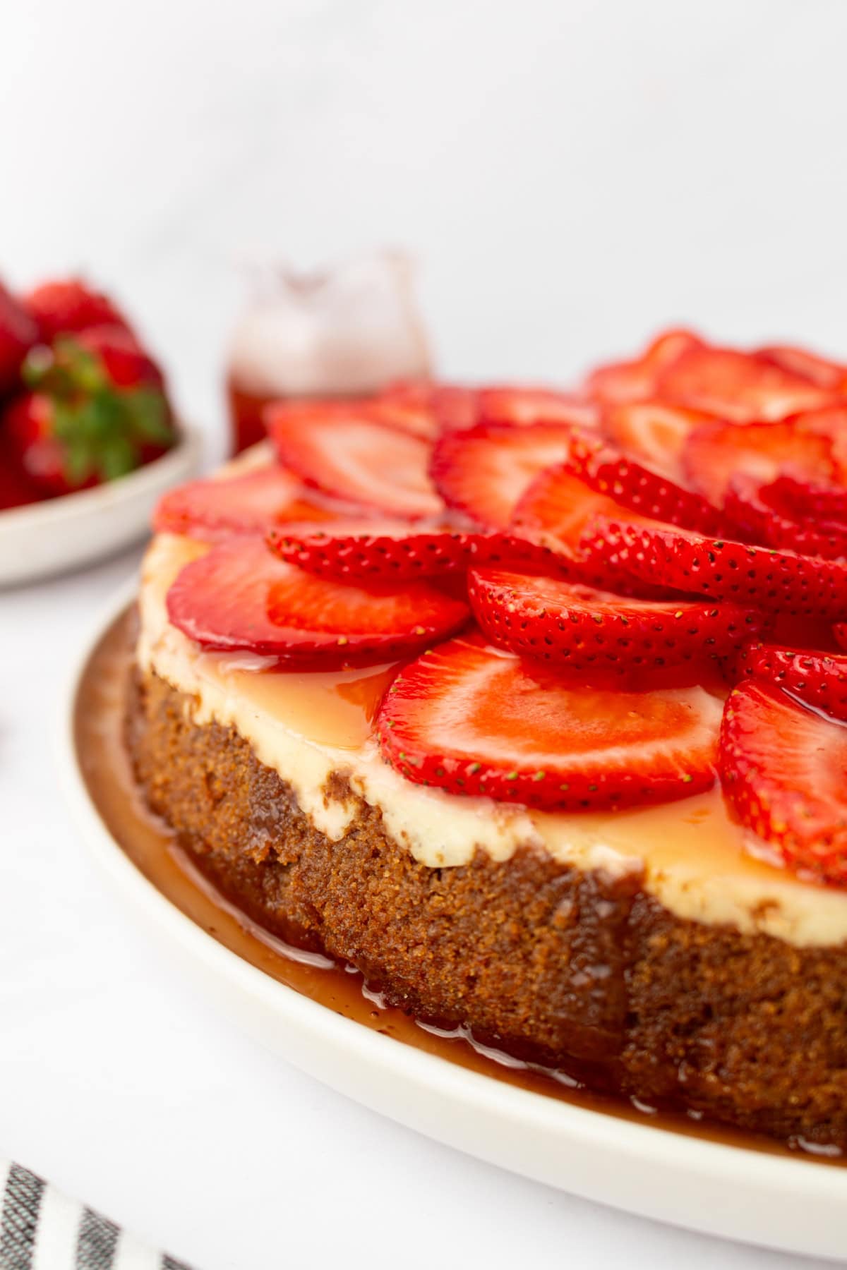 strawberry cheesecake with fresh strawberries on top