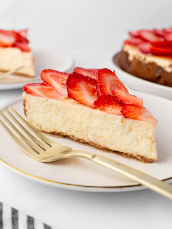 slice of strawberry cheesecake on a plate