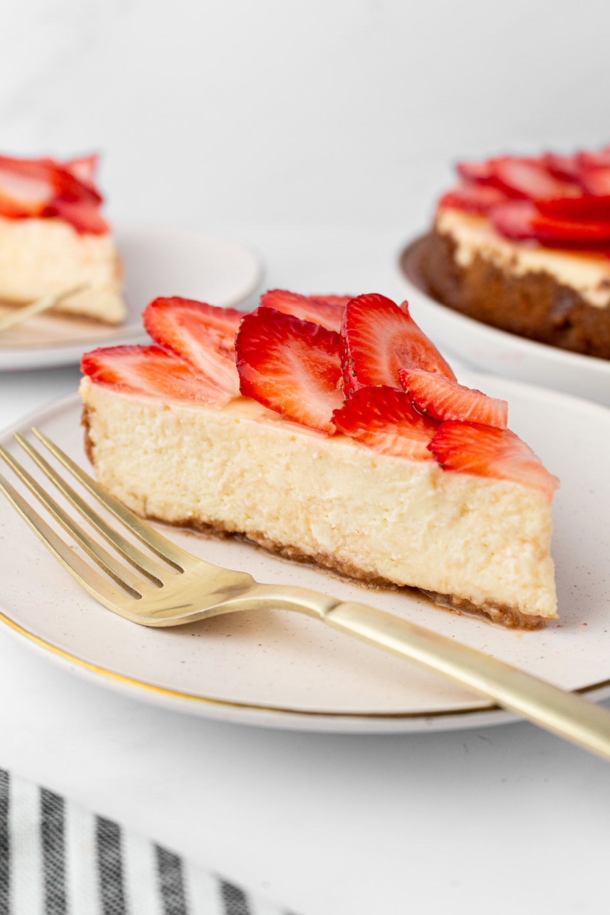 slice of strawberry cheesecake on a plate