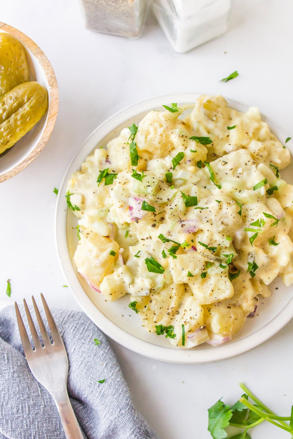 Sweet Pickle Potato Salad : a creamy potato salad recipe from RecipeGirl.com serving of sweet pickle potato salad on plate