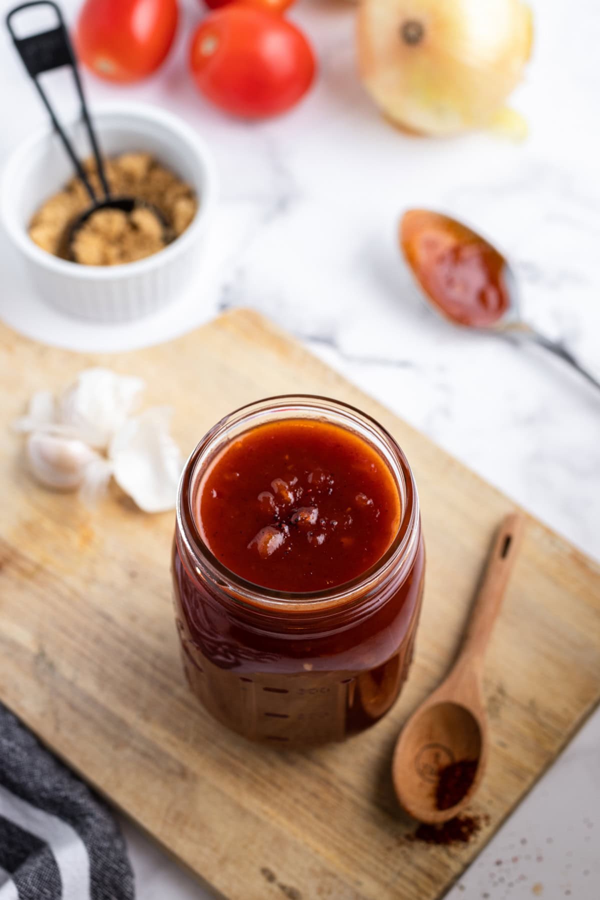 Homemade Barbecue Sauce recipe from RecipeGirl.com : sweet barbecue sauce, BBQ Sauce, Smoky Barbecue sauce looking down on open jar of homemade barbecue sauce