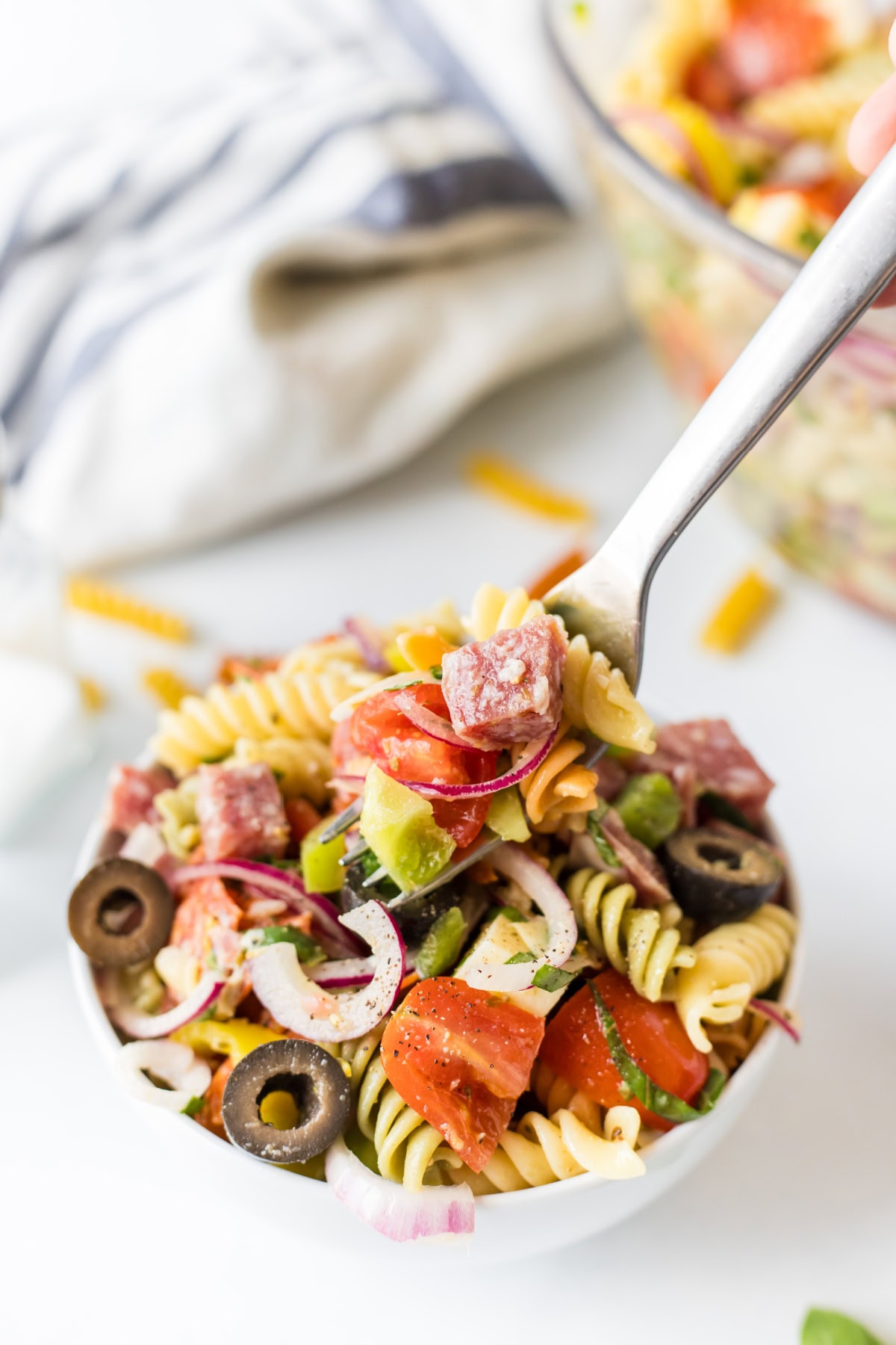 Antipasto Pasta Salad Recipe from RecipeGirl.com fork full of antipasto pasta salad
