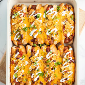 baked chili dogs in a casserole dish