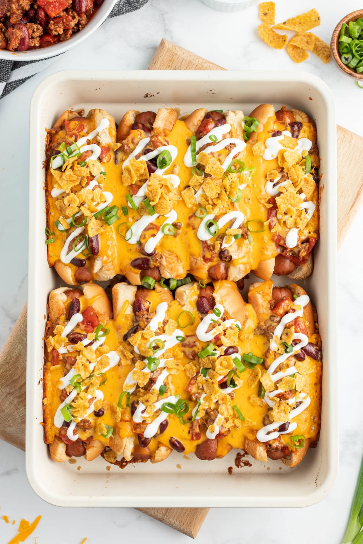 baked chili dogs in a casserole dish