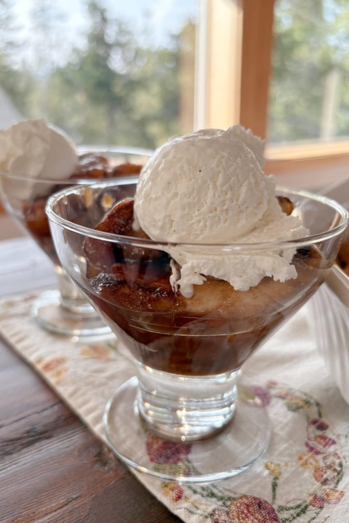 serving of crescent apple dumplings in dish with vanilla ice cream