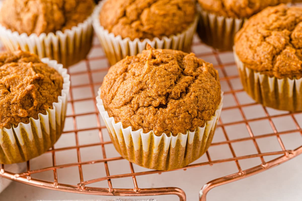 Healthy Pumpkin Muffins recipe from RecipeGirl.com close up healthy pumpkin muffins on a rack