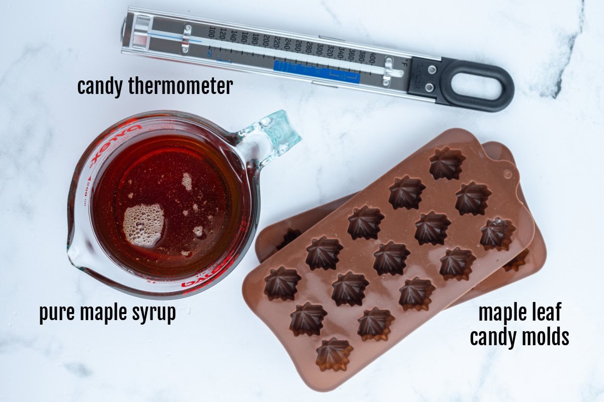 These Maple Syrup Candies are made with only one ingredient: pure maple syrup! Make them in maple leaf molds for cute results. Recipe from RecipeGirl.com. ingredients and equipment displayed for making maple candy