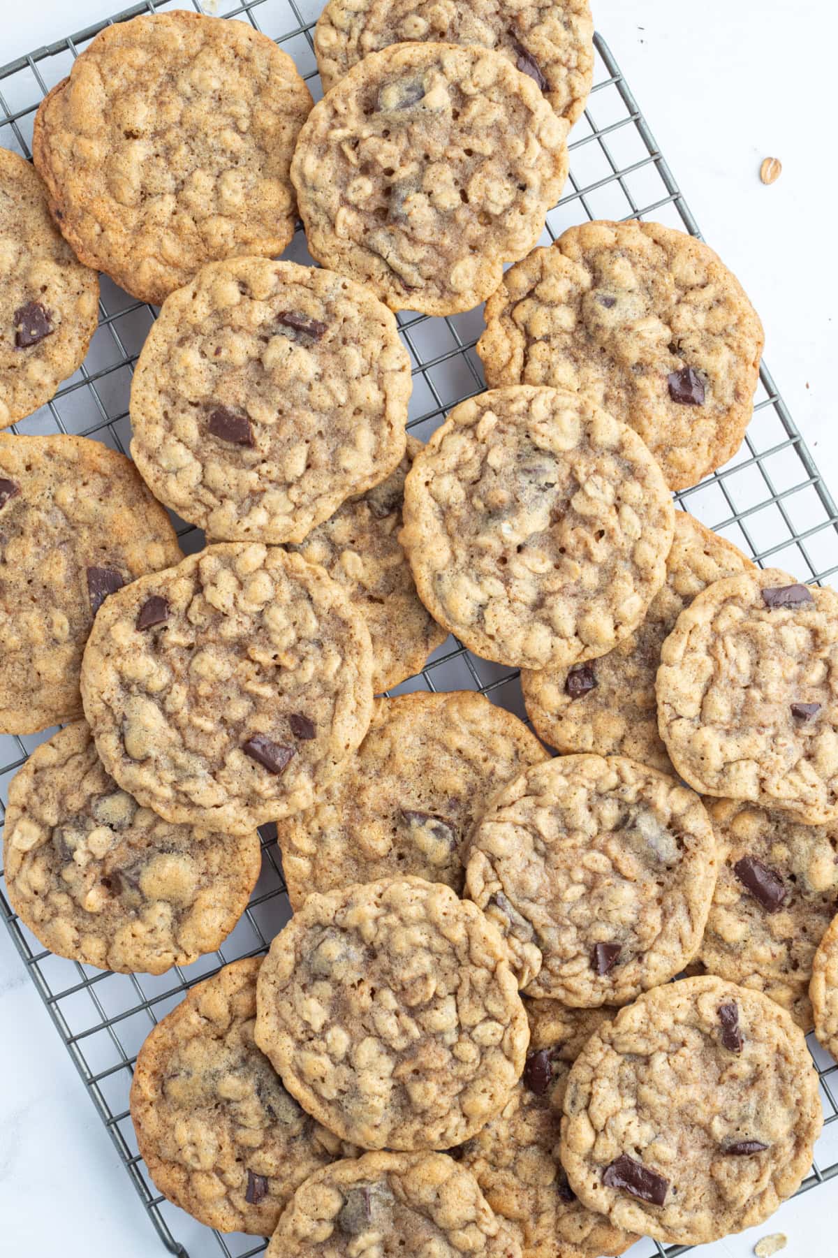 One Bowl Oatmeal Chocolate Chunk Cookies recipe from RecipeGIrl.com one bowl oatmeal chocolate chunk cookies on a cooling rack