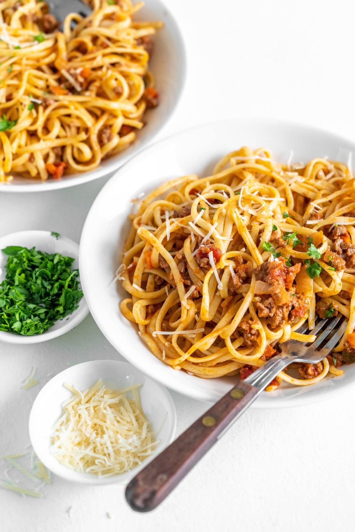 linguine with bolognese sauce in bowls