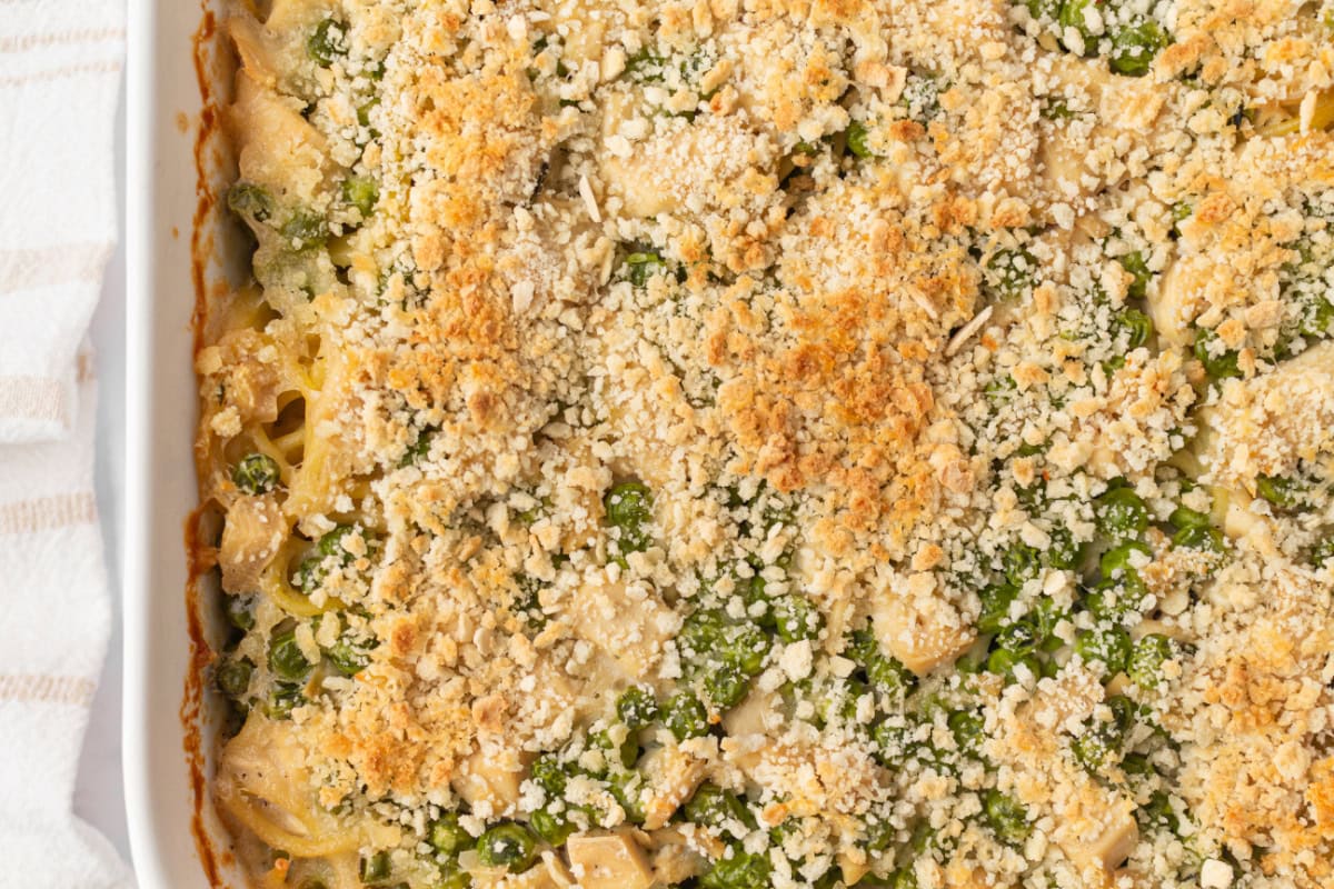 Chicken Tetrazzini is a great-tasting, creamy comfort food casserole, and there are no canned condensed soups used in this recipe! Recipe from RecipeGirl.com. peek at pan of chicken tetrazzini