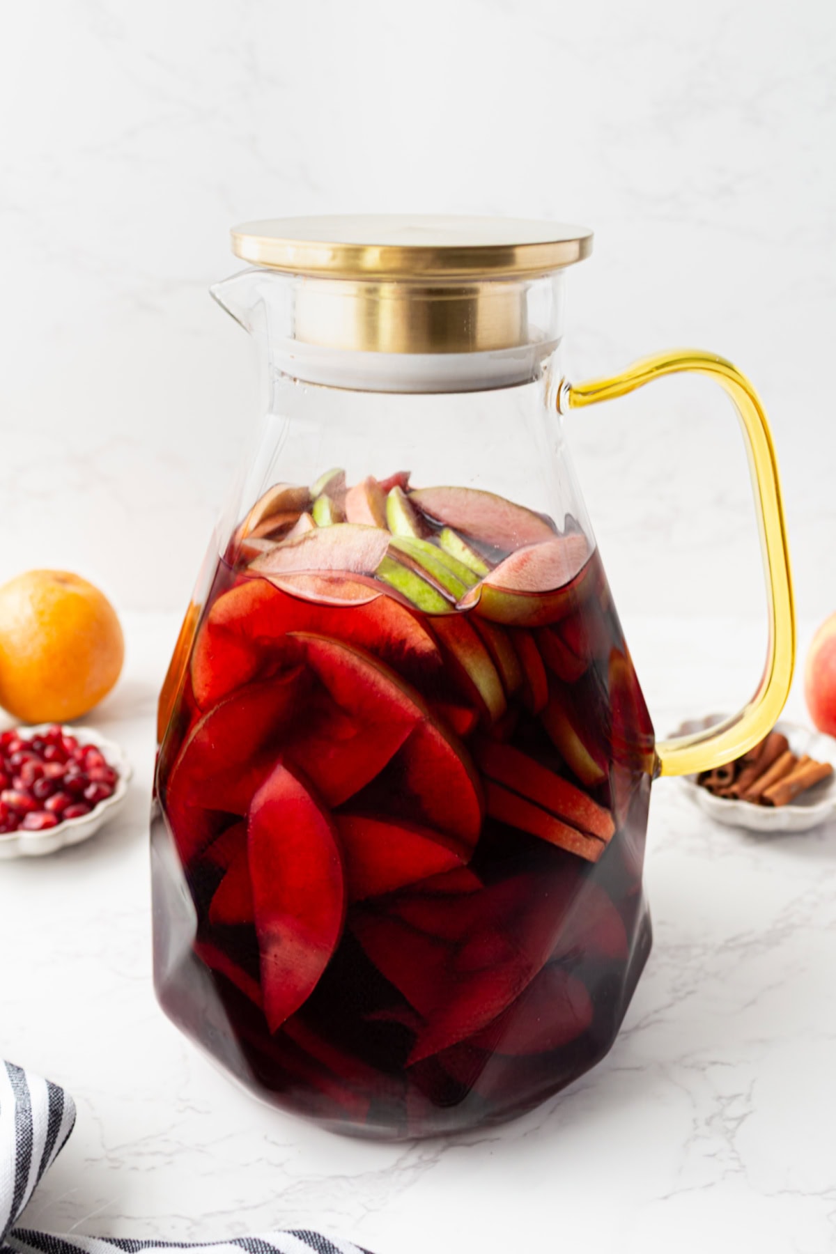 This sangria has all of the flavors of fall! Recipe from RecipeGirl.com. pitcher of fall sangria