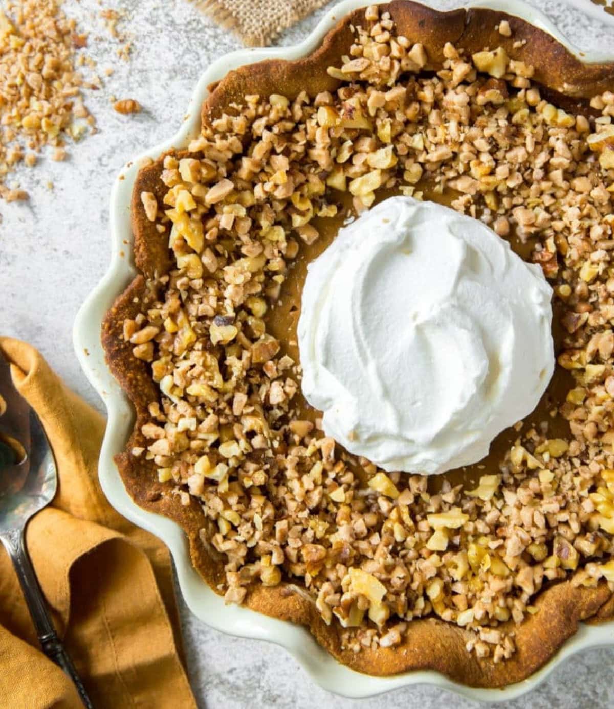 This Pumpkin Toffee Walnut Pie is baked as a traditional pumpkin pie, and as it comes out of the oven it is topped with toasted walnuts and toffee bits. Those extra touches give this pie its unique combination of flavors. whole pumpkin toffee walnut pie