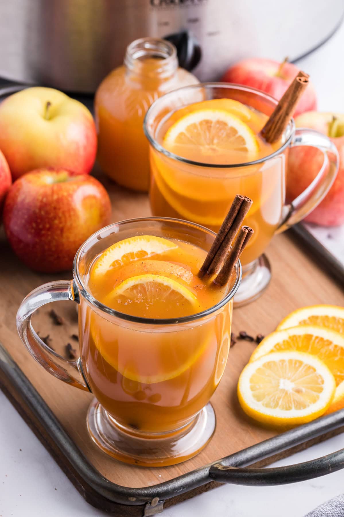 Slow Cooker Mulled Cider is the ultimate perfect warm, non-alcoholic apple cider beverage to make and enjoy during the fall and winter months. Recipe from RecipeGirl.com. mugs of slow cooker mulled cider