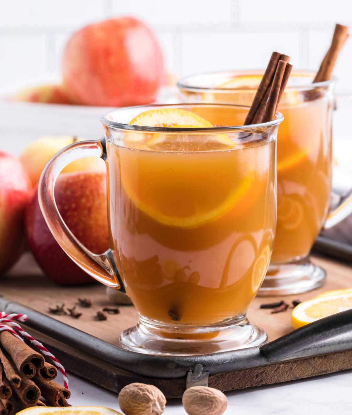 Slow Cooker Mulled Cider is the ultimate perfect warm, non-alcoholic apple cider beverage to make and enjoy during the fall and winter months. Recipe from RecipeGirl.com. slow cooker mulled cider in mugs