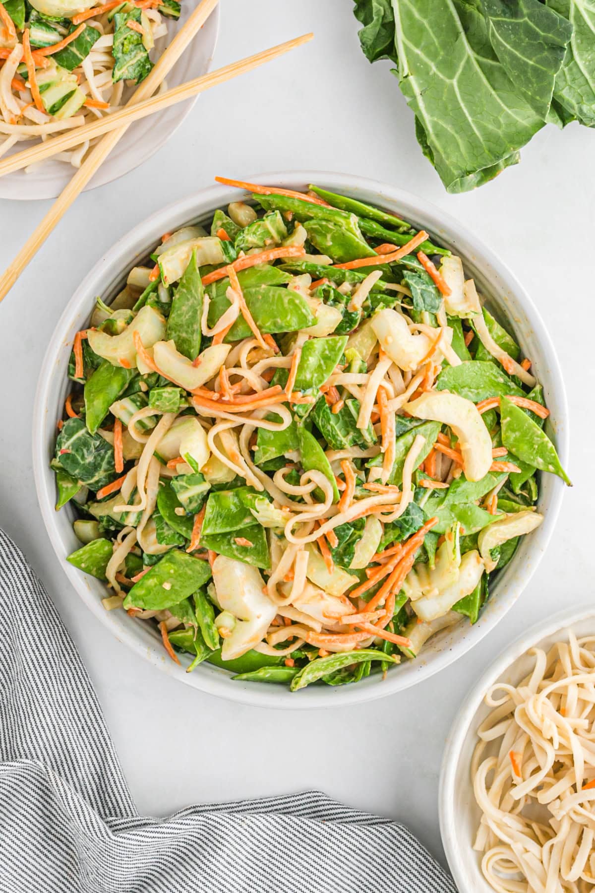 If you love a little heat, these Spicy Peanut Noodles will be your new obsession. A creamy, nutty sauce coats noodles and crunchy veggies — fast, flavorful, and perfect for busy weeknights! big bowl of spicy peanut noodles and asian vegetables