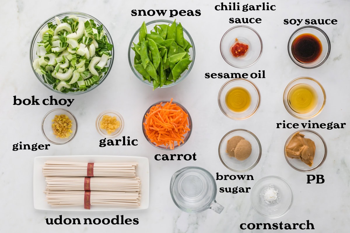 If you love a little heat, these Spicy Peanut Noodles will be your new obsession. A creamy, nutty sauce coats noodles and crunchy veggies — fast, flavorful, and perfect for busy weeknights! ingredients displayed for making spicy peanut noodles