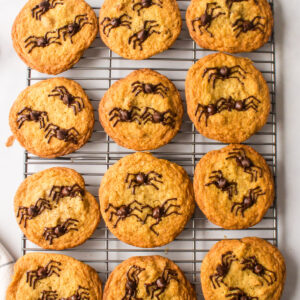 halloween spider cookies on a baking rack