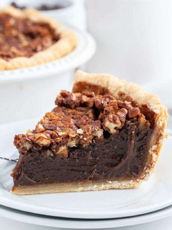 slice of bourbon chocolate pecan pie on a plate