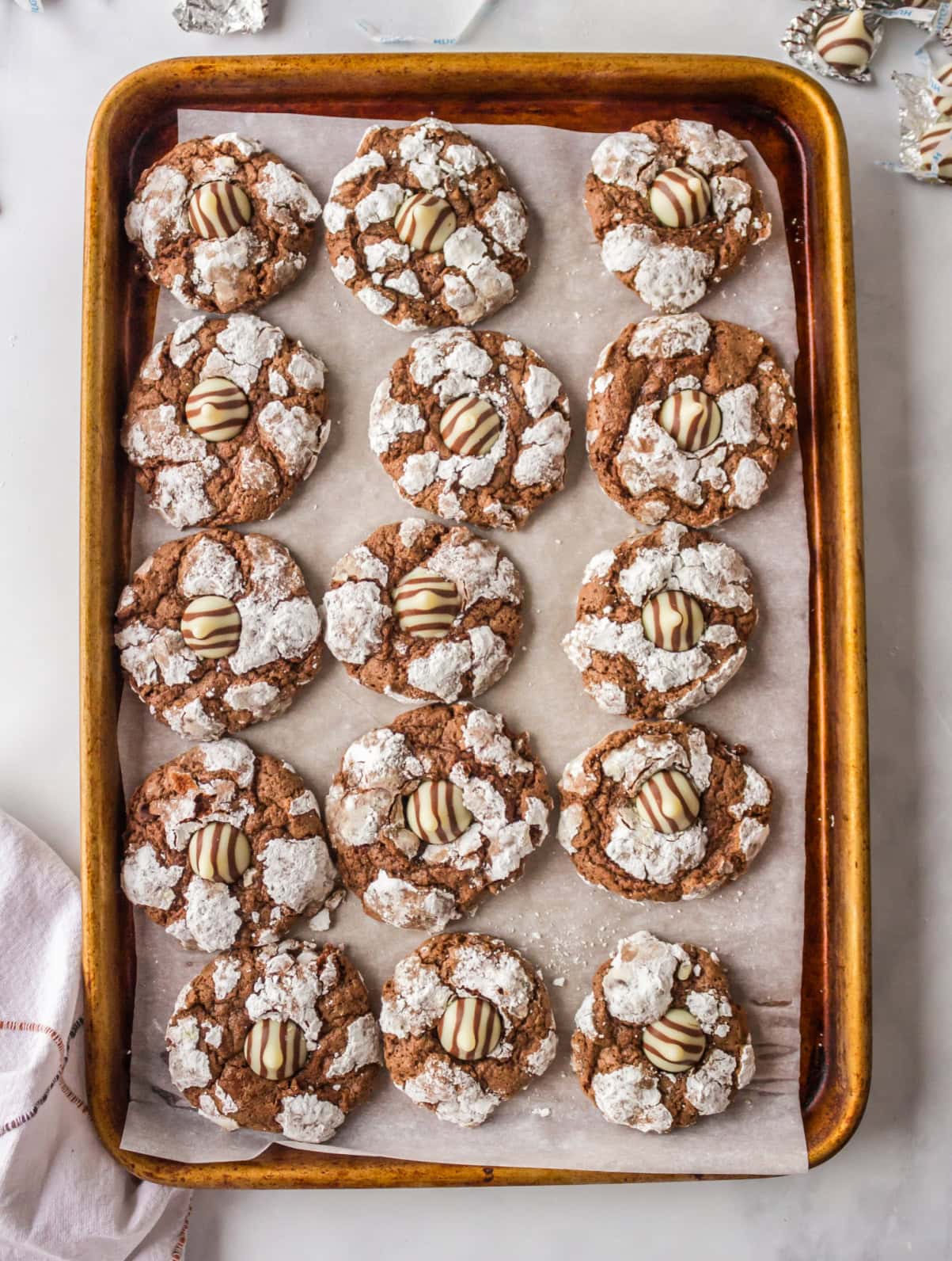 baking sheet with chocolate chocolate kiss cookies