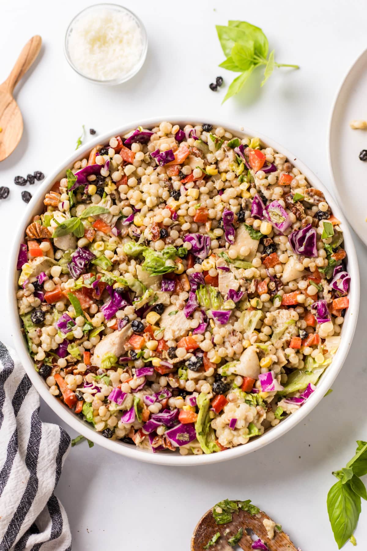 This Chopped Chicken and Couscous Salad with Sweet Basil Dressing is fresh, flavorful, and flexible! Swap turkey, wild rice, and cranberries for a fall twist. chopped chicken and couscous salad