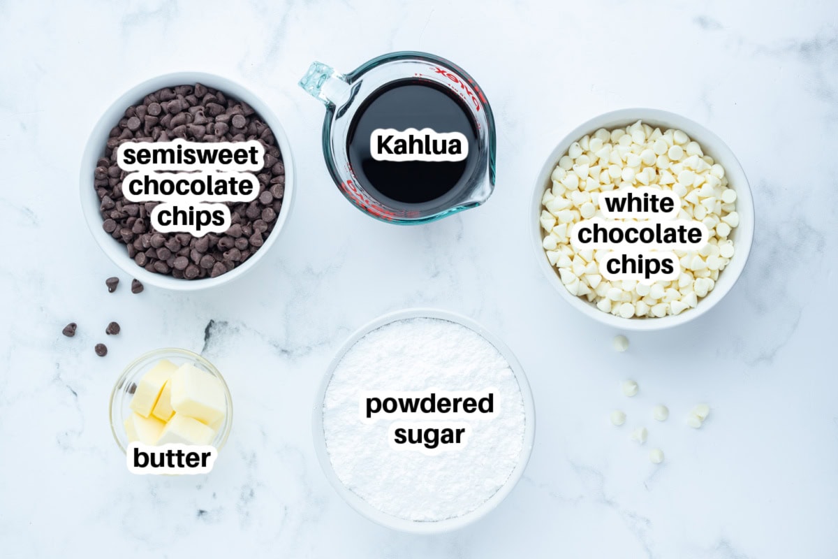 This Easy Microwave Kahlua Fudge has two chocolate layers, a rich Kahlua coffee flavor, and comes together in minutes. Perfect for holiday gifts and dessert trays! ingredients displayed for making kahlua fudge