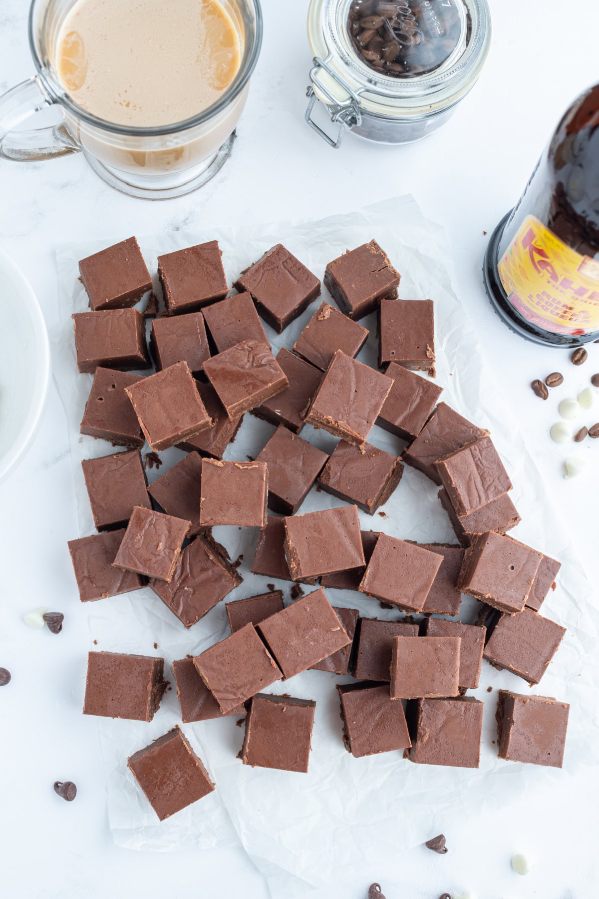 This Easy Microwave Kahlua Fudge has two chocolate layers, a rich Kahlua coffee flavor, and comes together in minutes. Perfect for holiday gifts and dessert trays! lots of pieces of kahlua fudge