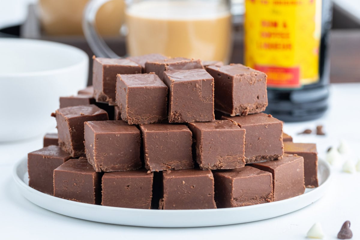 This Easy Microwave Kahlua Fudge has two chocolate layers, a rich Kahlua coffee flavor, and comes together in minutes. Perfect for holiday gifts and dessert trays! platter of kahlua fudge