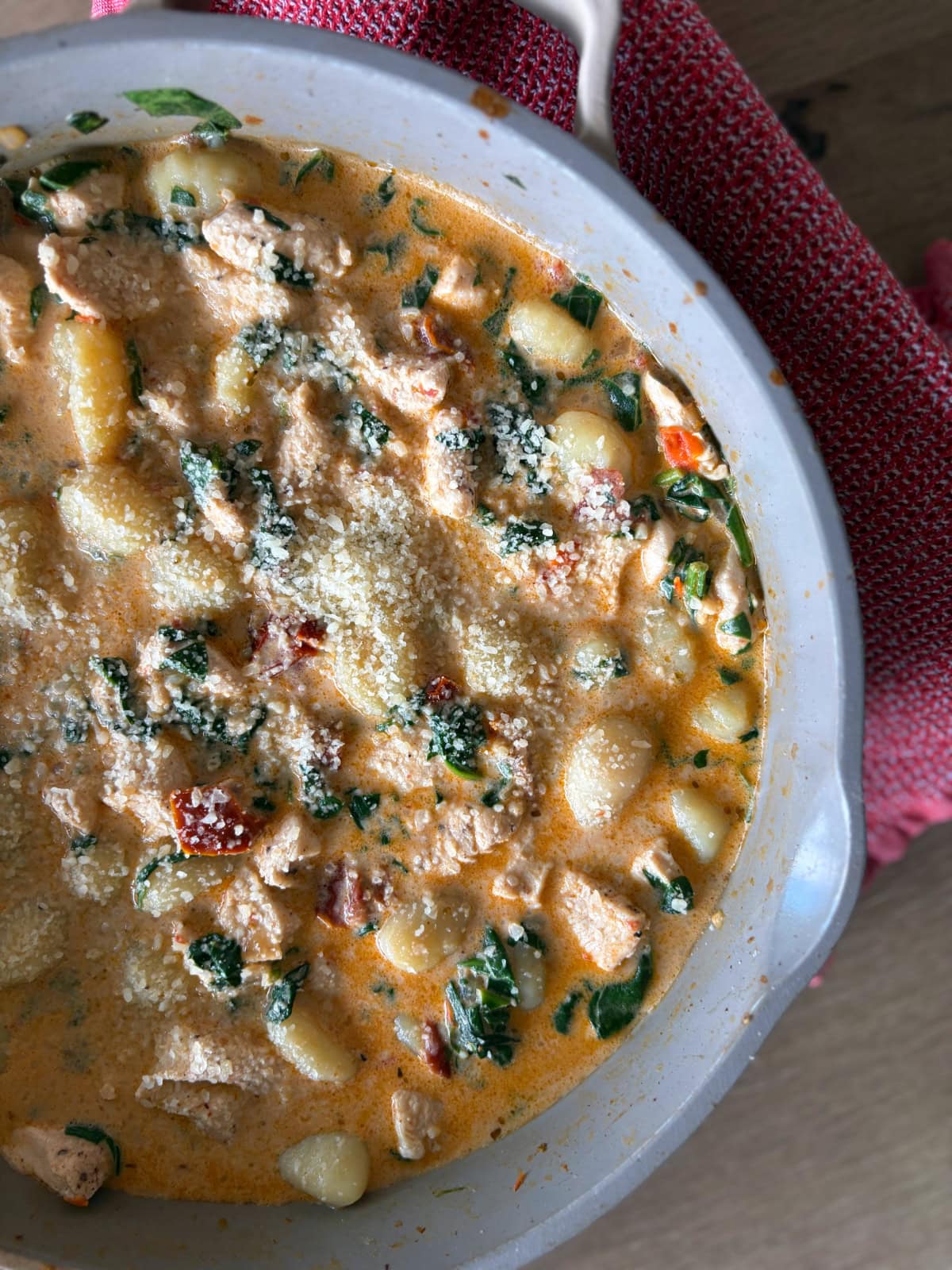 peek at half a skillet full of marry me chicken gnocchi