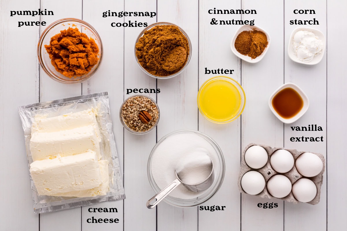 This creamy Pumpkin Swirl Cheesecake has a buttery gingersnap-pecan crust and a gorgeous marbled swirl of pumpkin and cheesecake. Perfect for Thanksgiving or any cozy fall celebration! Top with caramel or whipped cream for an irresistible dessert everyone will love. ingredients displayed for making pumpkin swirl cheesecake