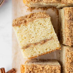 slices of copycat starbucks cinnamon coffee cake with one sitting on its side